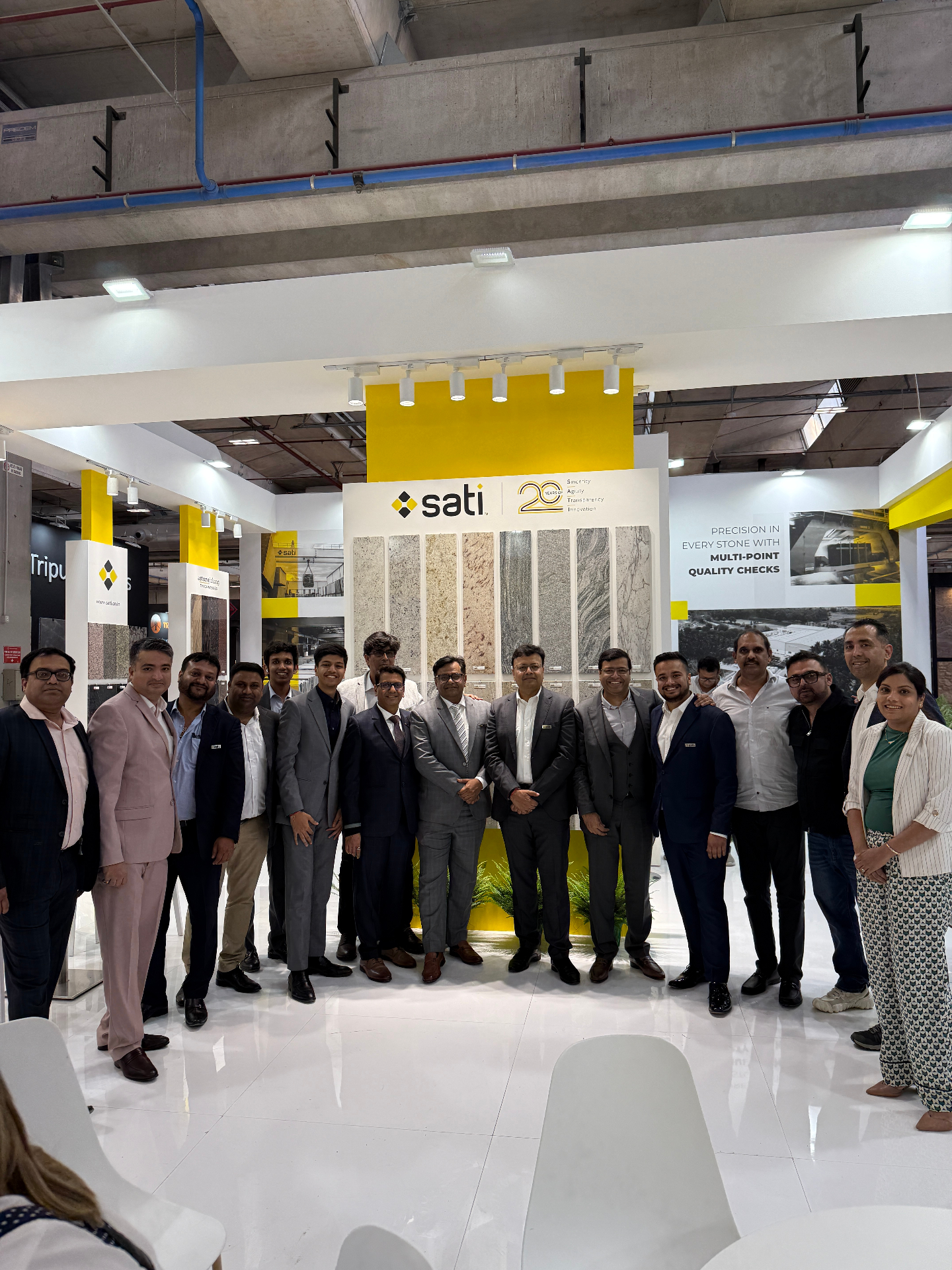 The Sati Exports team at the company showroom marking 20 years in stone